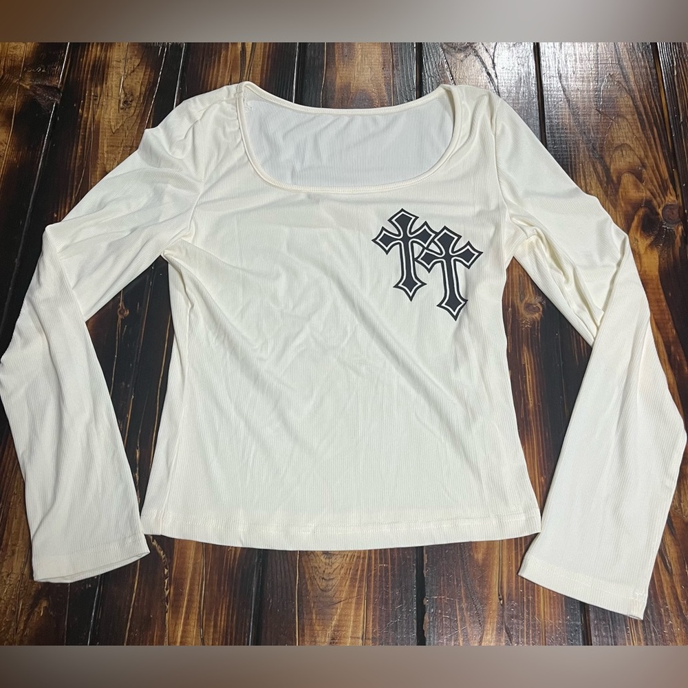 Off white ribbed long sleeve with cross designs.